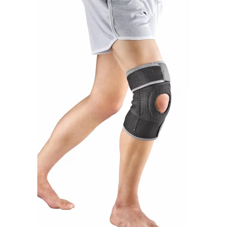 Knee brace on a person's leg with a white background - okotoks hc pharmacy