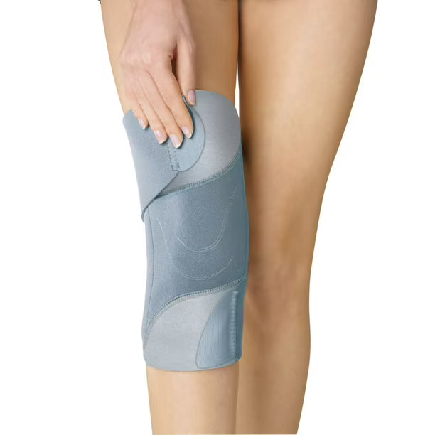 Blue knee brace on a person's leg with a white background - okotoks hc pharmacy