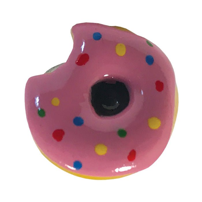 Pink donut-shaped object with colorful sprinkles on a white background - okotoks hc pharmacy