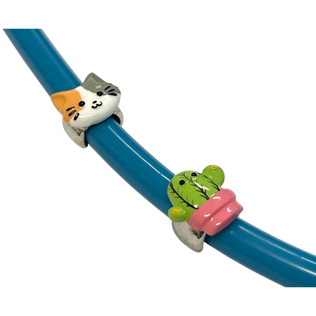 Cat-shaped stethoscope jewelry with a cactus design on a blue background - okotoks hc pharmacy
