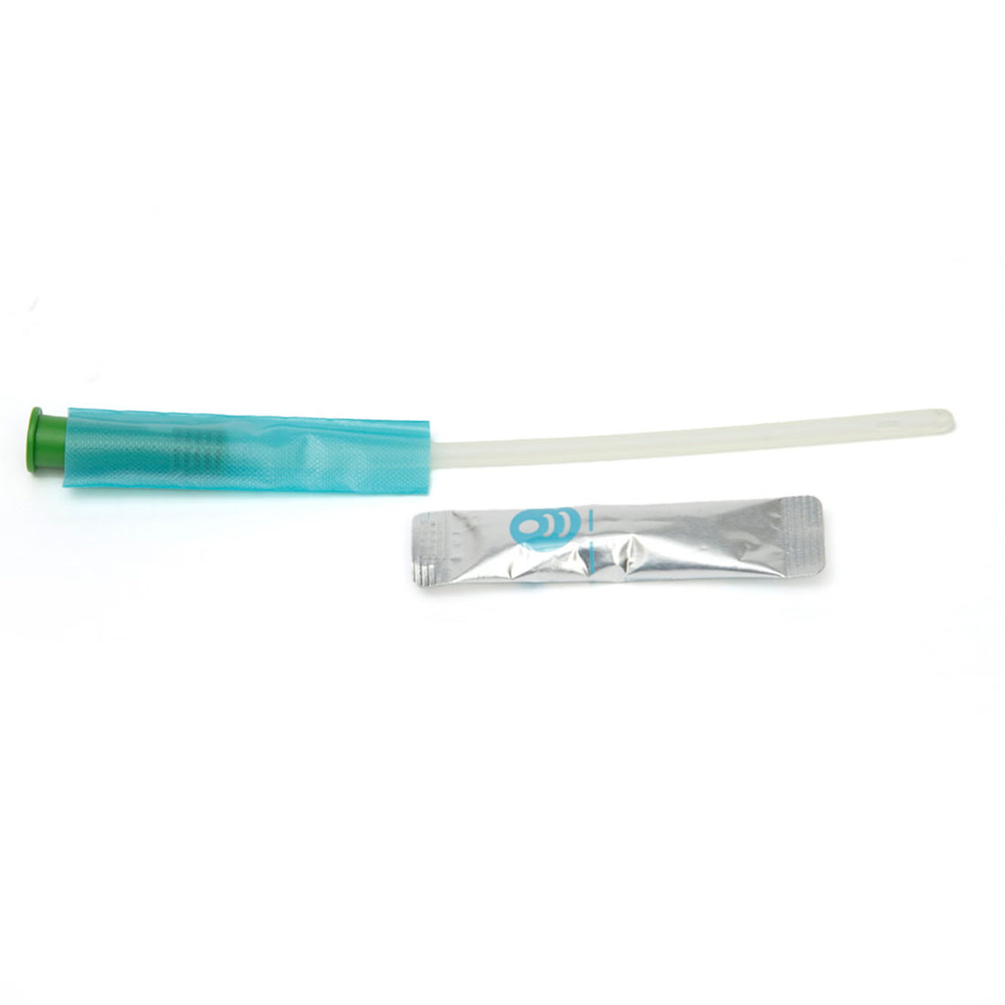 A clear plastic catheter tube with a translucent teal handle and green tip, shown alongside a small silver foil packet on a plain white background. - okotoks hc pharmacy