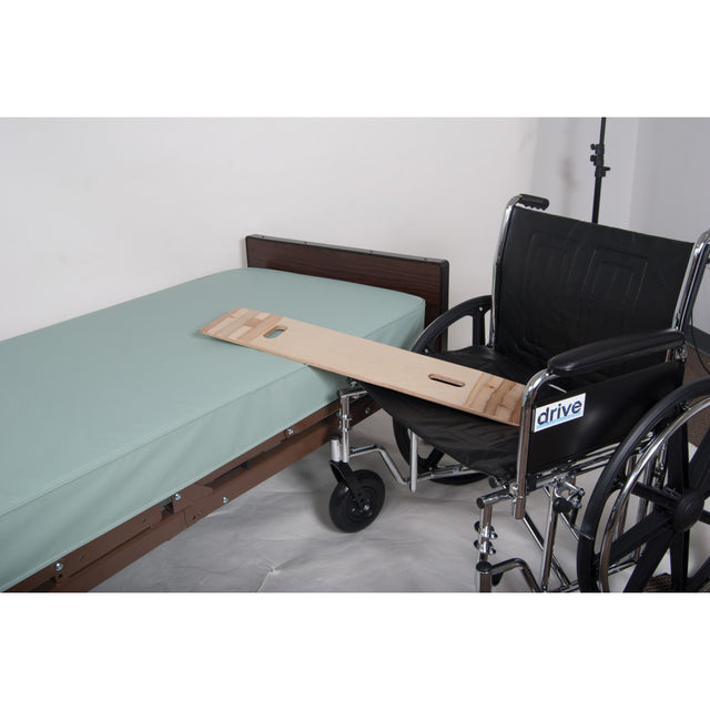 Wheelchair with a wooden board attached to a bed in a room. - okotoks hc pharmacy