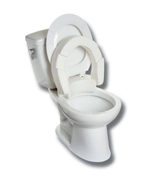 White toilet with a seat cover on a white background - okotoks hc pharmacy