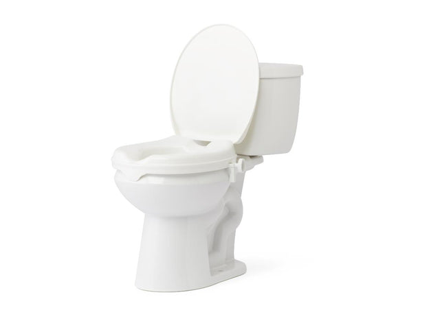 A white ceramic toilet with the lid open, shown from a three-quarter angle on a plain white background. - okotoks hc pharmacy