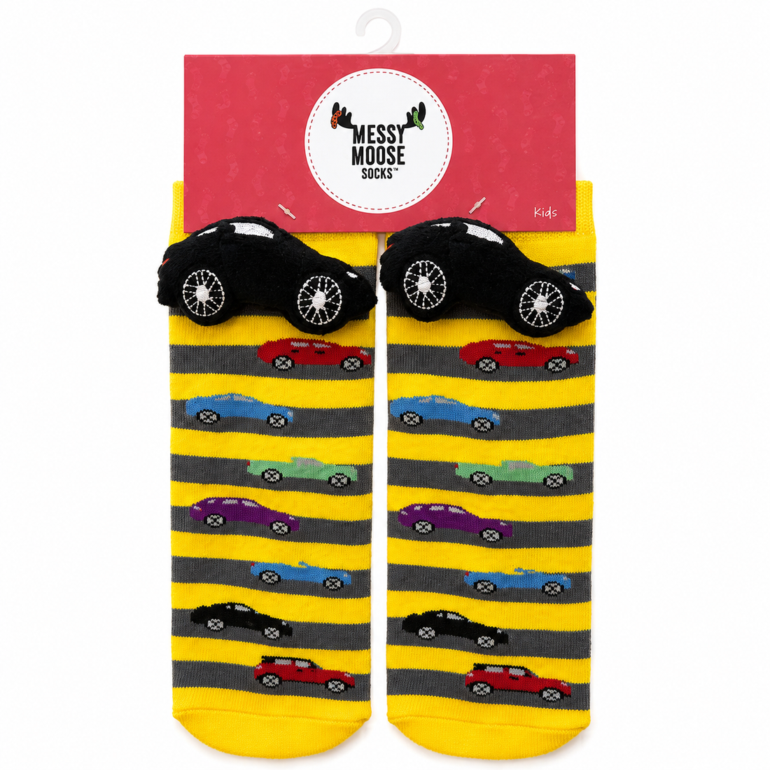 A pair of children's novelty socks in yellow and gray stripes with cartoon cars, shown hanging from a red 'Messy Moose Socks' retail hanger. The socks feature black car-shaped heels and toes with white wheels, and smaller multicolored cars printed along the sides. - okotoks hc pharmacy