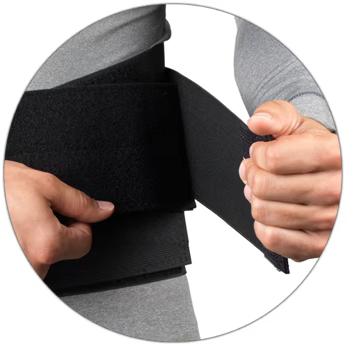 Person wearing a black compression wrap on a white background - okotoks hc pharmacy