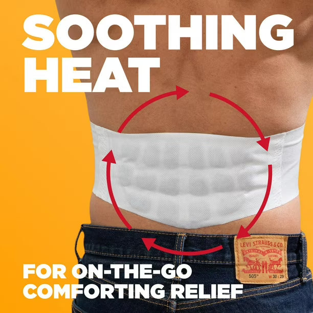 Person wearing a heating pad on their stomach with text 'Soothing Heat' and 'For On-The-Go Comforting Relief' on an orange background. - okotoks hc pharmacy