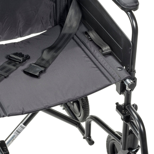 Close-up of a black wheelchair with a folded seat cover on a white background - okotoks hc pharmacy