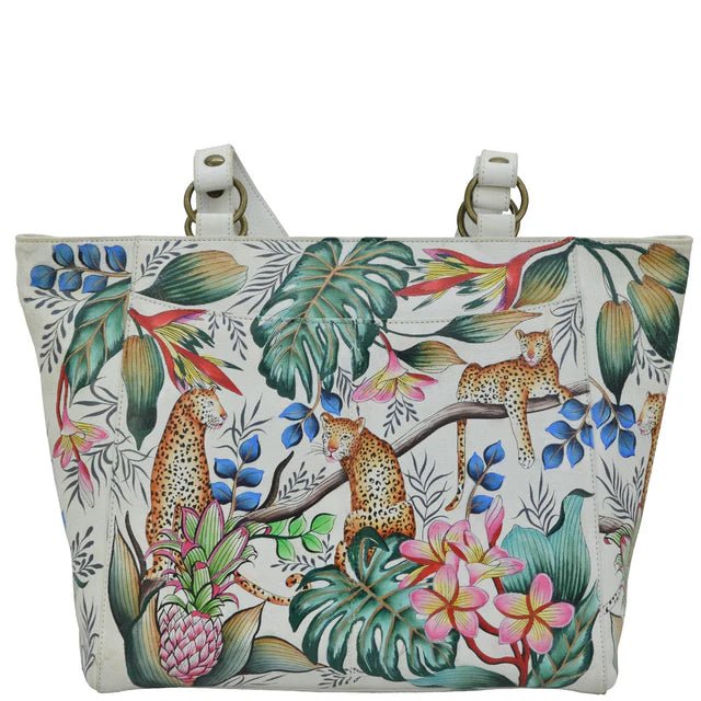 Tote bag with a tropical design featuring leopards, flowers, and leaves on a white background. - okotoks hc pharmacy