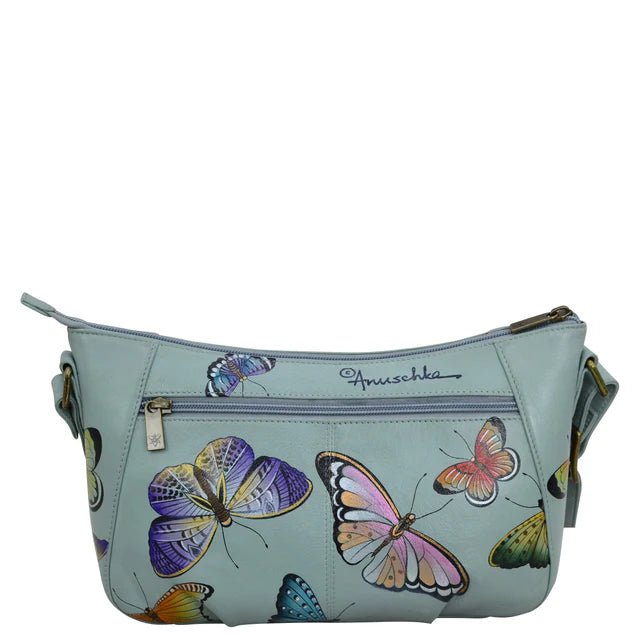 Light blue handbag with butterfly designs on a white background - okotoks hc pharmacy