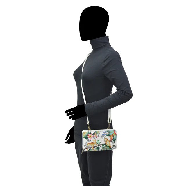Silhouette of a person wearing a floral-patterned handbag on a white background - okotoks hc pharmacy