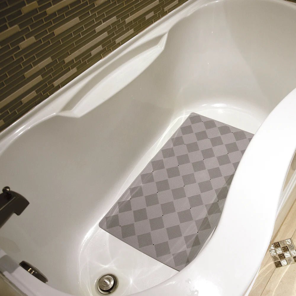 Gray checkered bath mat on a white bathtub with tiled walls. - okotoks hc pharmacy
