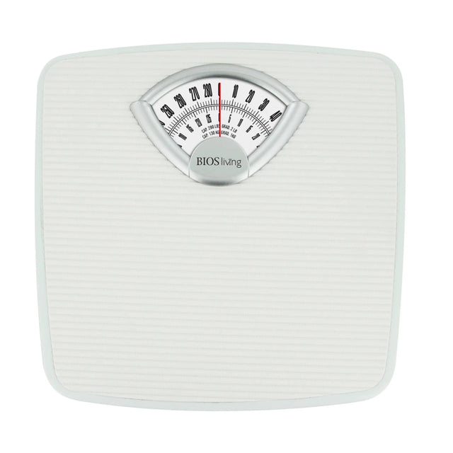 White mechanical bathroom scale with a dial on a white background - okotoks hc pharmacy