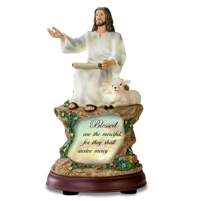 Statue of Jesus figure with a lamb and inspirational quote on a white background - okotoks hc pharmacy