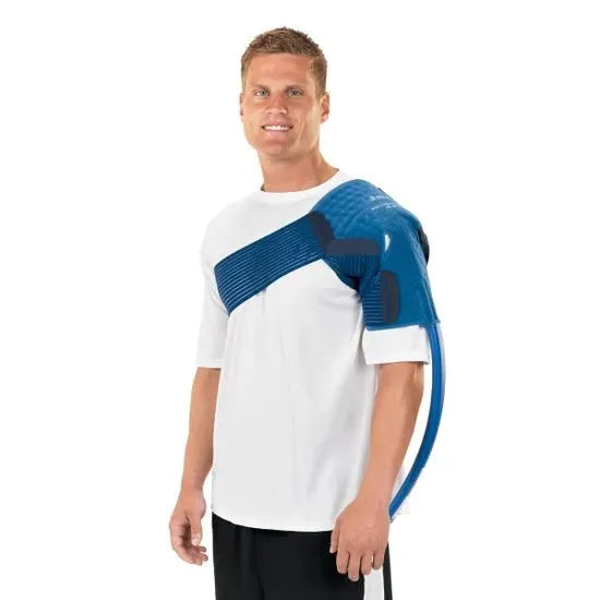 Man wearing a white shirt with a blue and black shoulder brace on a white background - okotoks hc pharmacy