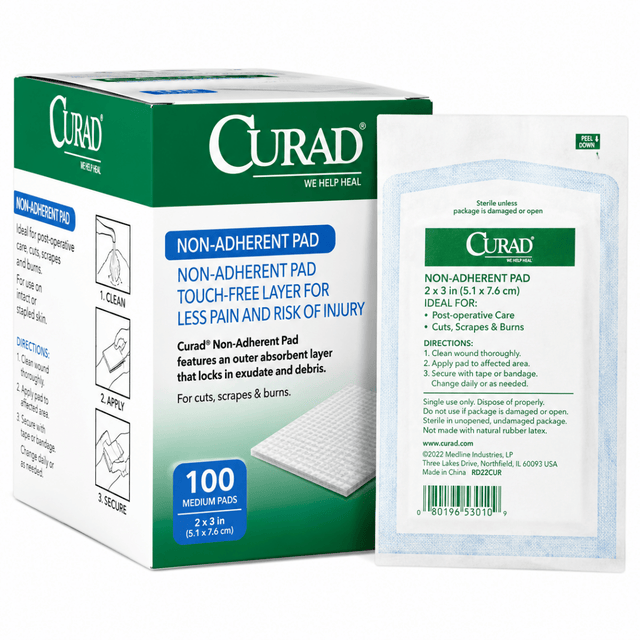 Curad non-adherent pad packaging with a single pad displayed in front on a white background - okotoks hc pharmacy