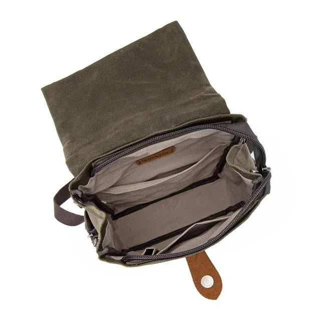 Green waxed canvas bag with a brown leather strap on a white background - okotoks hc pharmacy