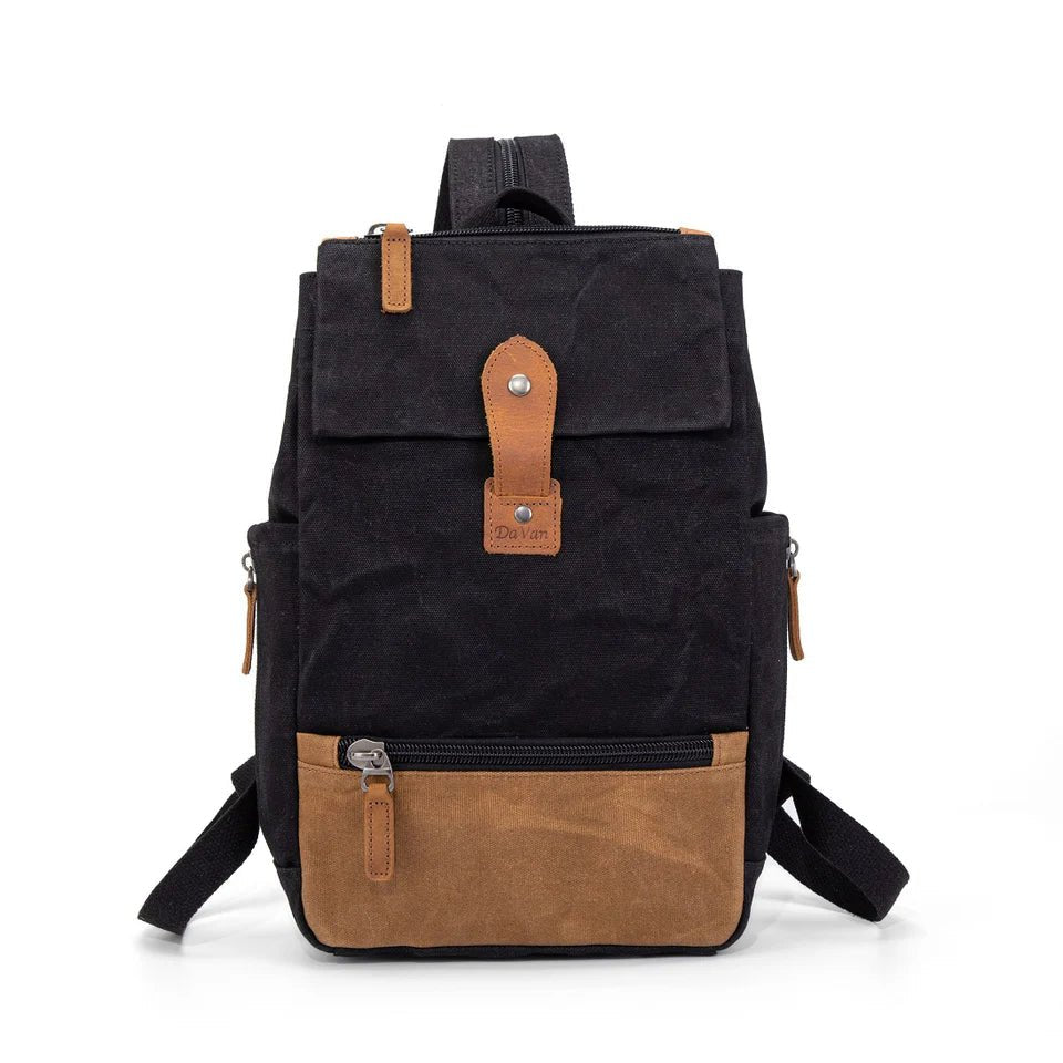 Black backpack with brown accents on a white background - okotoks hc pharmacy