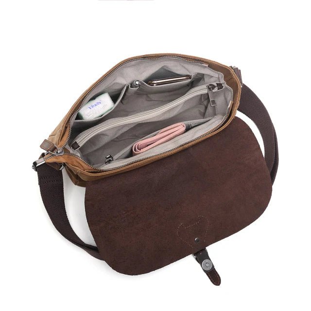 Brown leather bag with open front pocket showing interior details on a white background - okotoks hc pharmacy