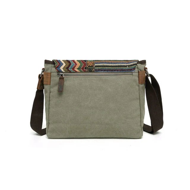 Green canvas crossbody bag with a colorful striped zipper on a white background - okotoks hc pharmacy