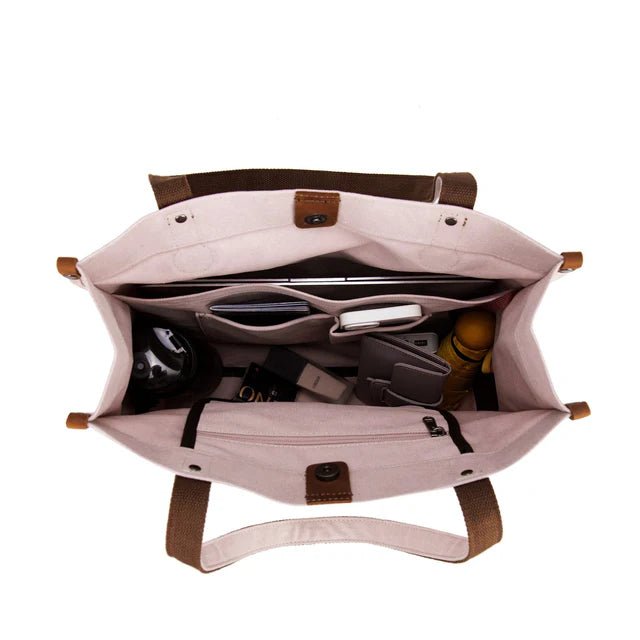 Open beige bag with brown straps and interior compartments on a white background - okotoks hc pharmacy