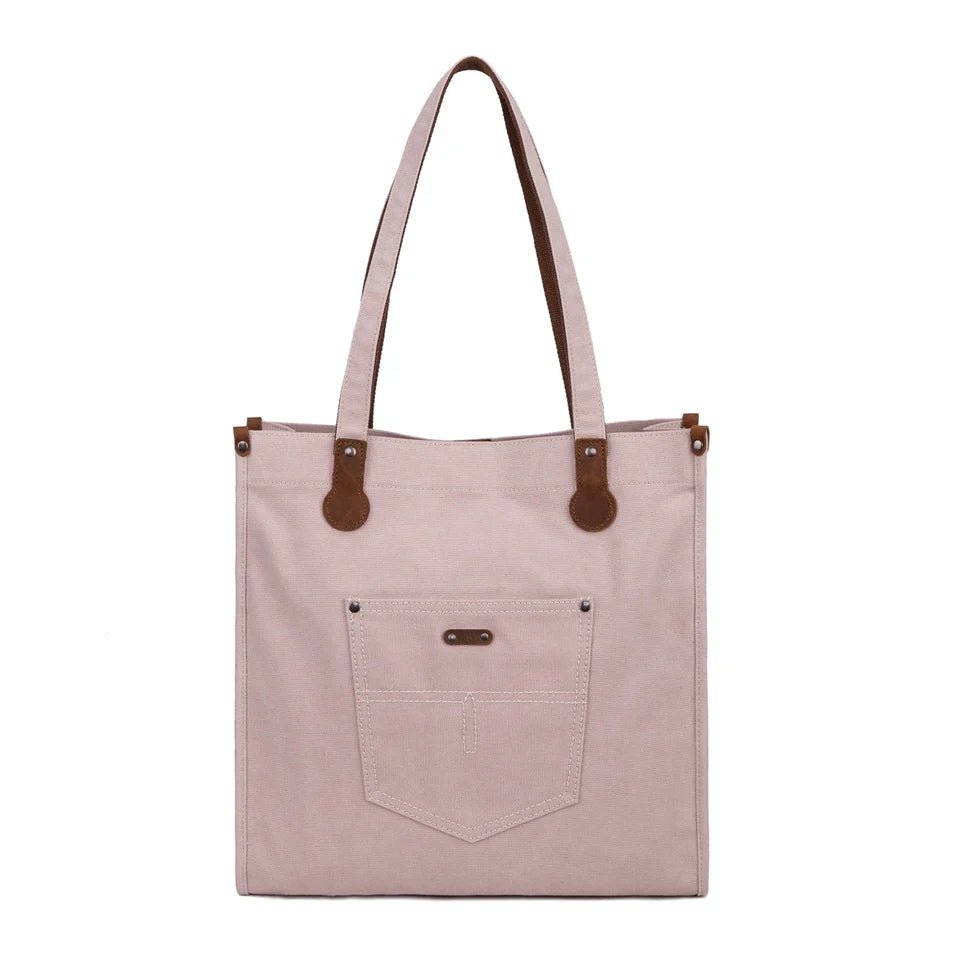 pink tote bag with brown leather accents on a white background - okotoks hc pharmacy