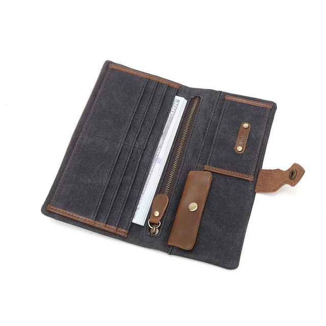 Open dark blue wallet with brown accents on a white background - okotoks hc pharmacy