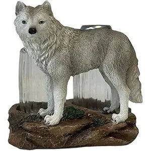 Statue of a wolf on a rock with a scenic background - okotoks hc pharmacy