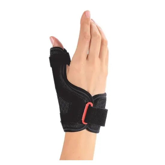 Black thumb support brace on a hand against a white background - okotoks hc pharmacy