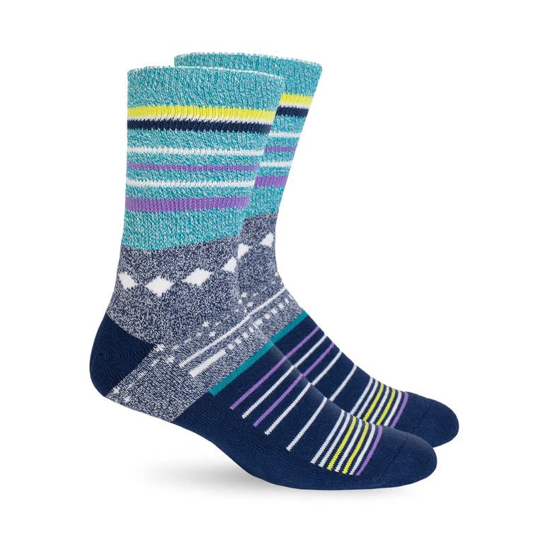 A pair of crew socks with a multicolor pattern featuring teal, navy, gray, purple, and yellow stripes, displayed on a clean white background. - okotoks hc pharmacy