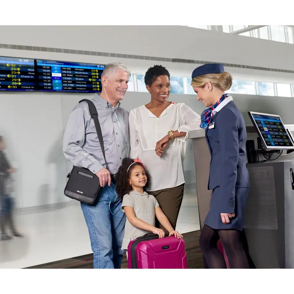 family at the airport and a family member carrying derive portable oxygen concentrator in a black bag