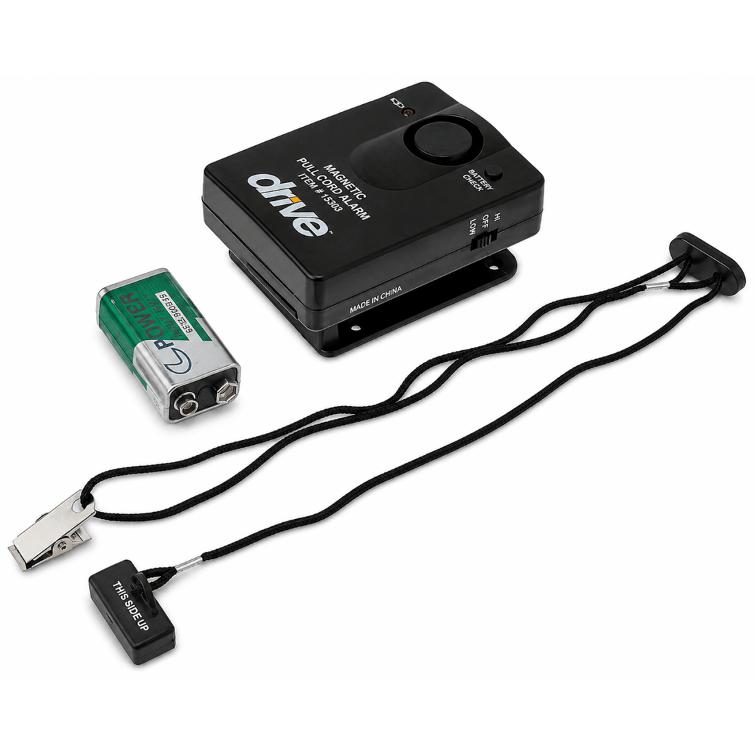 Drive Medical Magnetic Pull Cord Alarm, featuring a black control box, a green and silver 9V battery, a black clip, and a black wrist strap with a transmitter end, all on a white background. - okotoks hc pharmacy
