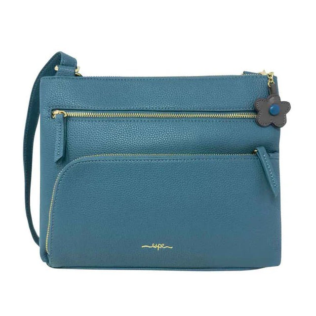 Blue handbag with a visible brand logo on a white background - okotoks hc pharmacy