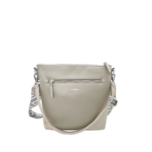 Light gray handbag with a patterned strap on a white background - okotoks hc pharmacy