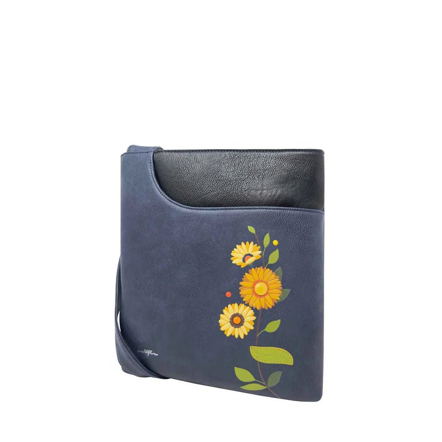 Blue handbag with floral design on a white background - okotoks hc pharmacy