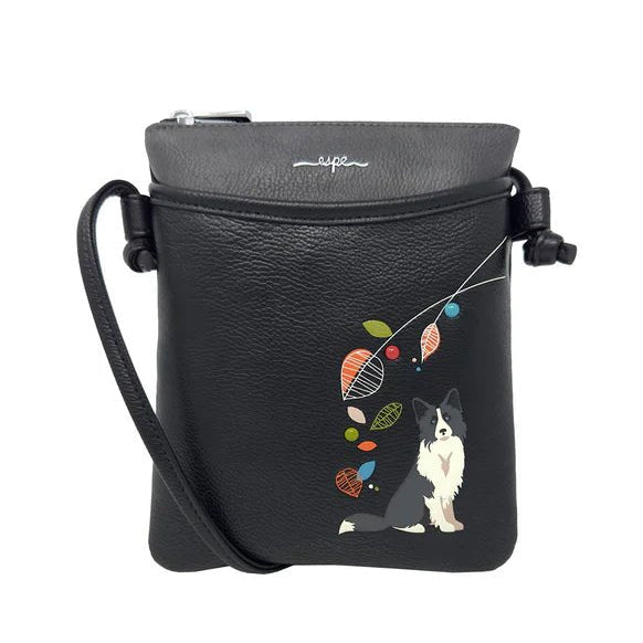Black crossbody bag with a dog and colorful leaves design on a white background - okotoks hc pharmacy