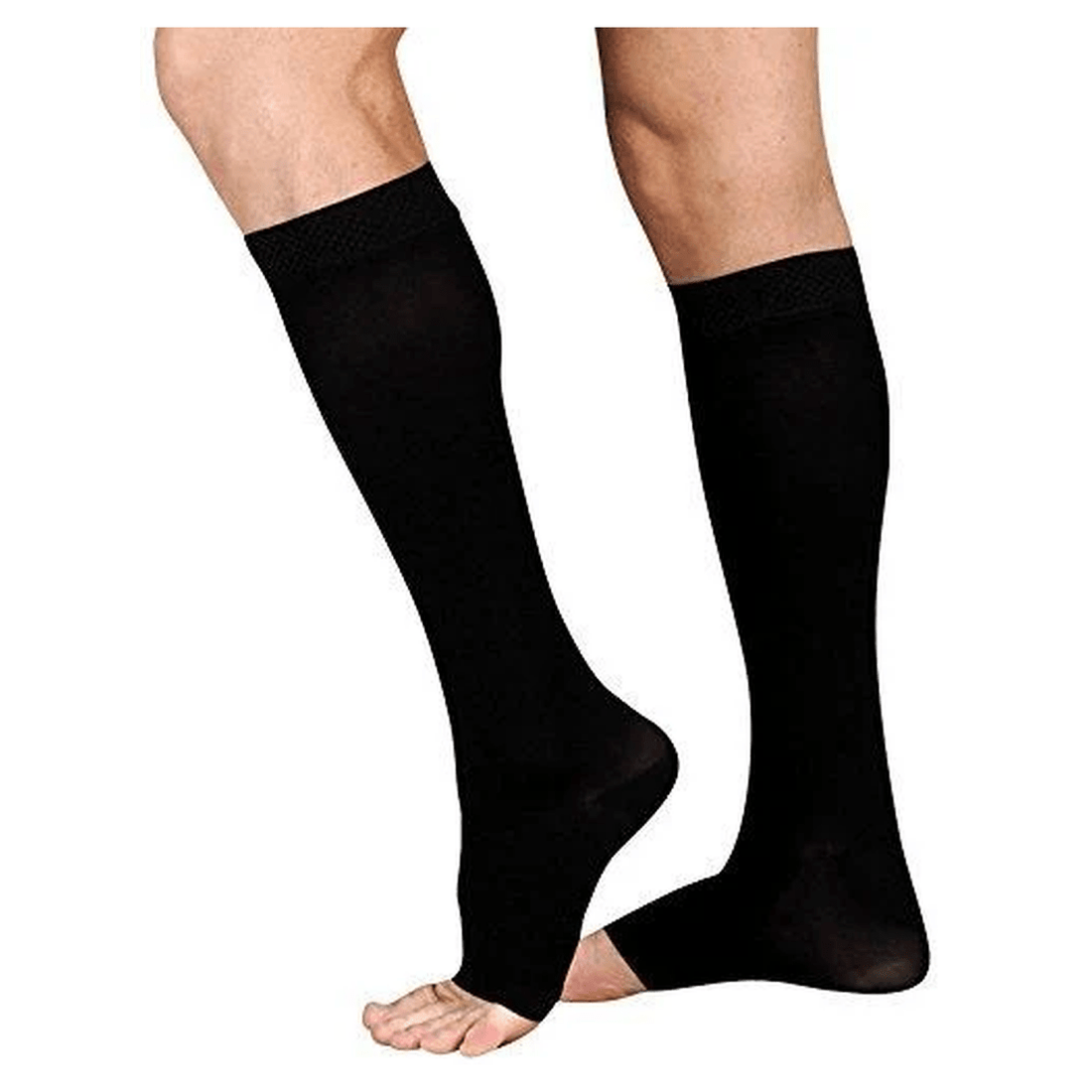A pair of black knee-high compression socks worn on a person's legs, shown against a plain white background. - okotoks hc pharmacy