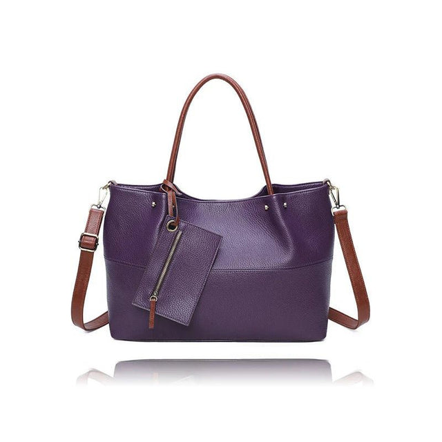 Purple handbag with brown straps on a white background - okotoks hc pharmacy