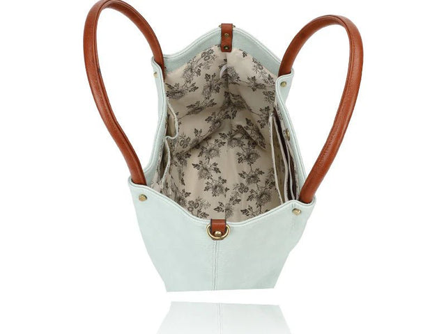 Light blue handbag with brown handles and floral interior on a white background - okotoks hc pharmacy