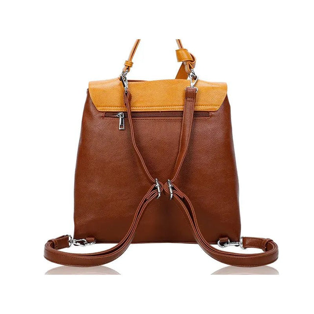 Brown leather backpack with yellow top section on a white background - okotoks hc pharmacy