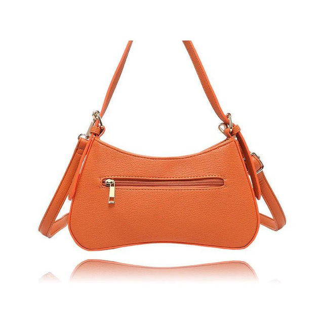 An orange pebbled faux-leather shoulder bag with a curved crescent shape, featuring a front zippered pocket with a gold-tone zipper pull and a matching adjustable shoulder strap, shown on a white background with a reflection below. - okotoks hc pharmacy