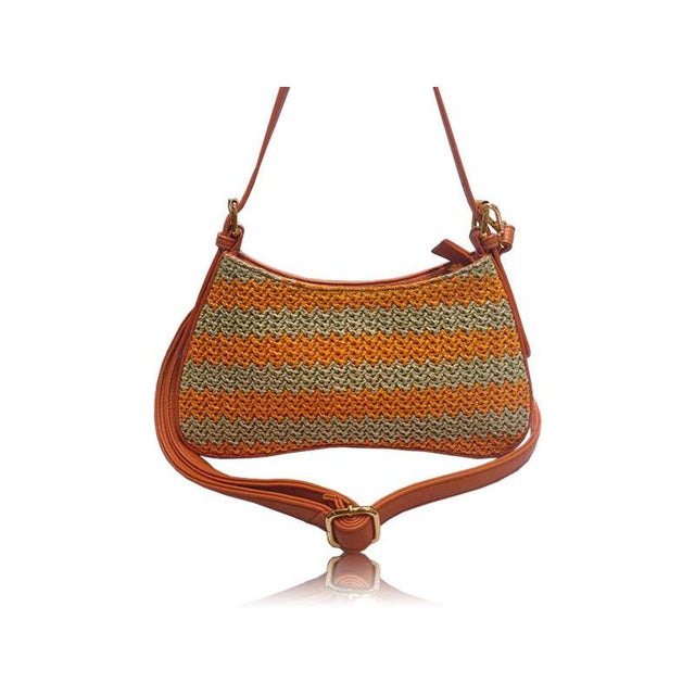 A small shoulder bag with a brown leather strap and trim, featuring a textured woven body with horizontal stripes of orange, beige, and brown, shown on a white background with a reflection. - okotoks hc pharmacy