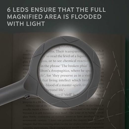 Magnifying glass with text about LEDs on a blurred book background - okotoks hc pharmacy