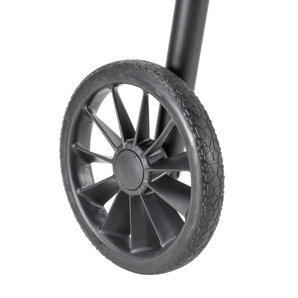 Close-up of a black wheel with tread pattern on a white background - okotoks hc pharmacy