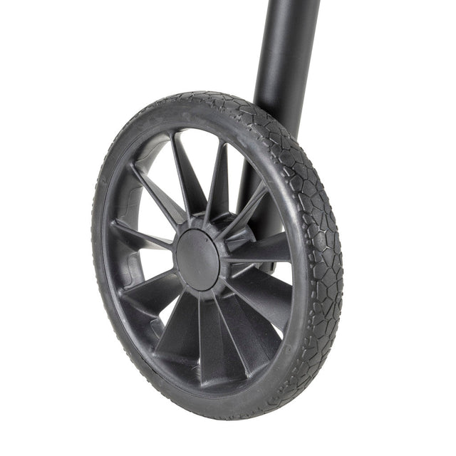 Close-up of a black wheel with tread pattern on a white background - okotoks hc pharmacy