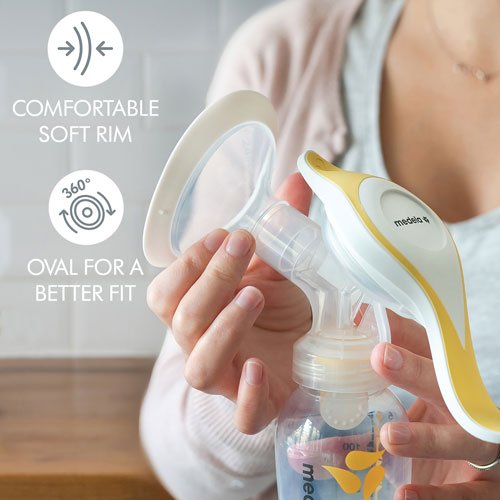 Person holding a breast pump with text highlighting features like 'Comfortable Soft Rim' and 'Oval for a Better Fit'. - okotoks hc pharmacy