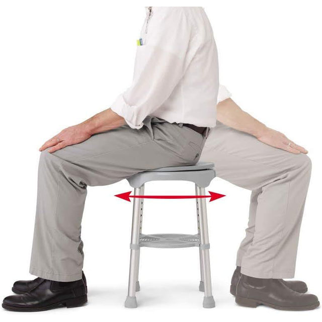Person sitting on a stool with legs apart, demonstrating proper posture. - okotoks hc pharmacy