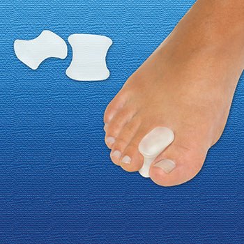 Foot with toe spreaders on a blue background - okotoks hc pharmacy