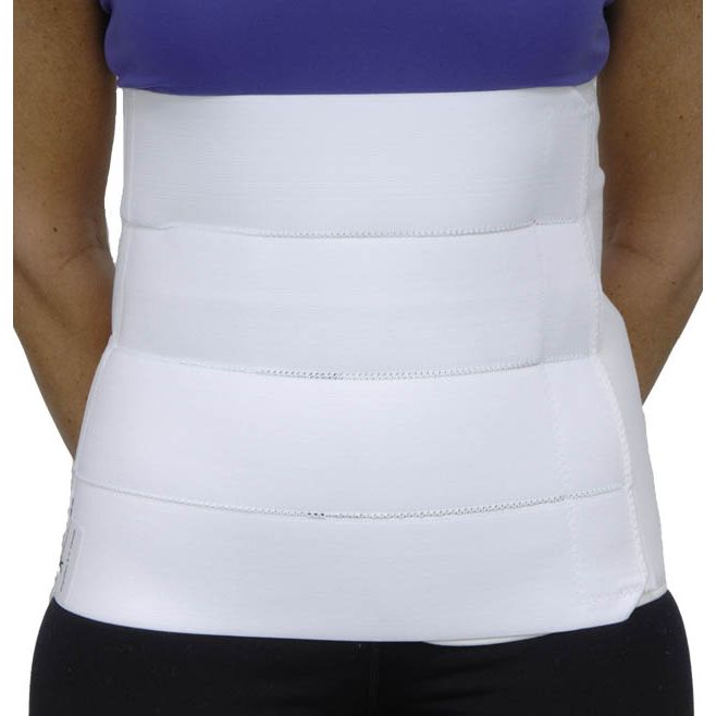 White waist support belt worn by a person with a blue top and black pants. - okotoks hc pharmacy