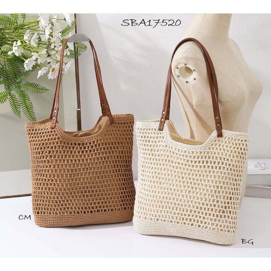 Two woven handbags, one brown and one beige, on mannequin stands with a blurred background. - okotoks hc pharmacy